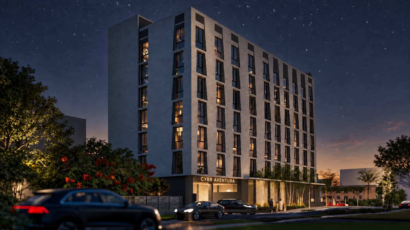 The long elevation and the corner at night, every window lit, the CYBR Aventura sign glowing over the entry and cars at the kerb.
