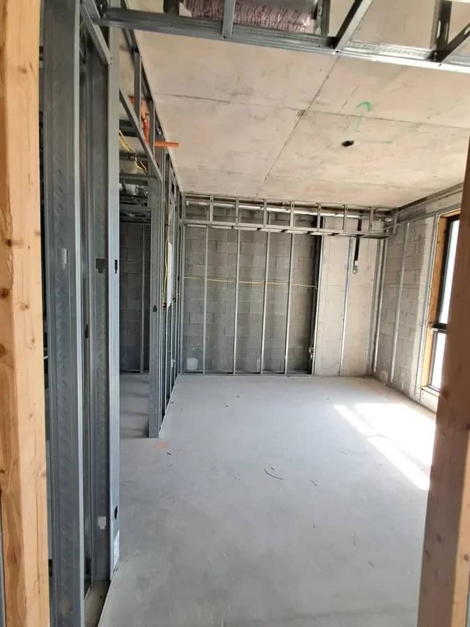 Aventura Quattro, photographed 14 May 2025: interior steel-stud partition framing under an open ceiling.